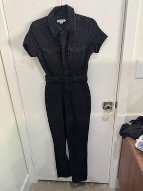 Good American Black Denim Jumpsuit with button and zipper closures